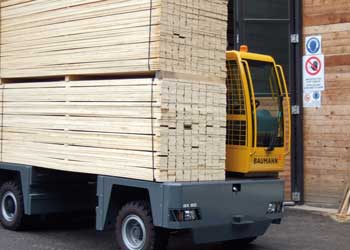 Baumann Sideloader carrying large stacks of cut lumber