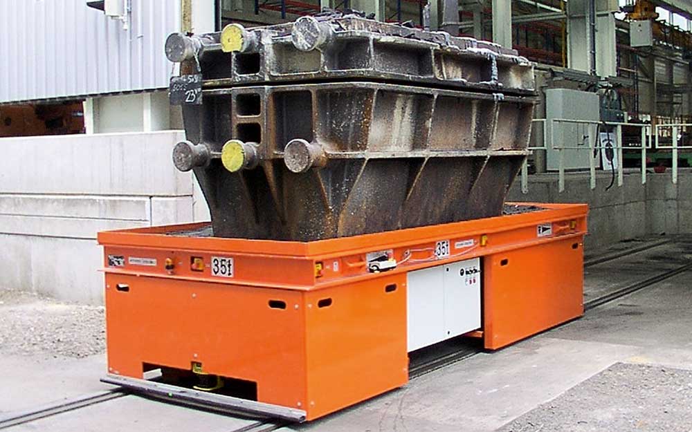 HUBTEX Rail Mounted Truck carrying a die